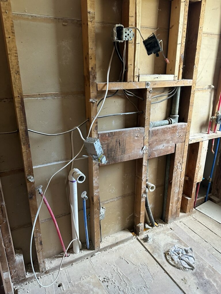 Bathroom gutted to studs mid-remodel
