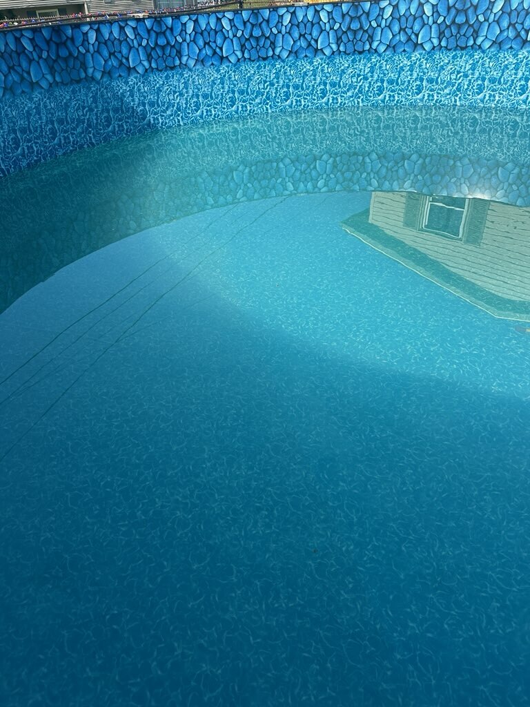 Same pool restored to clear blue water after cleaning and treatment