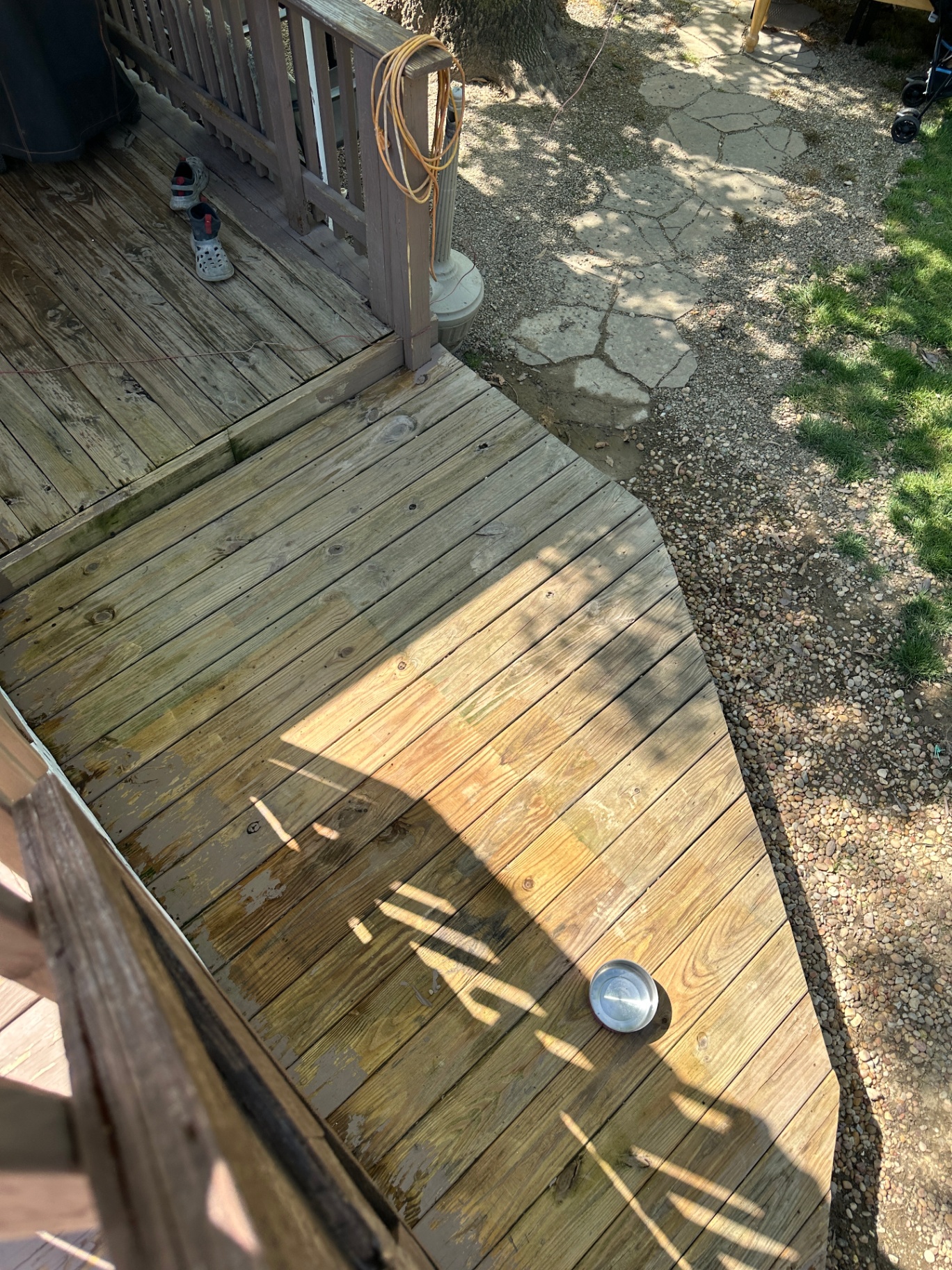 Deck refinishing prep — weathered boards washed and sanded, ready for stain